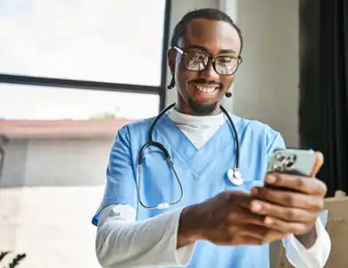 Male Nurse On Phone 1200X800